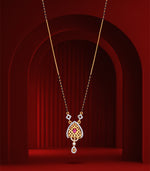Delicate mangalsutra with a heart-shaped pendant on a red background