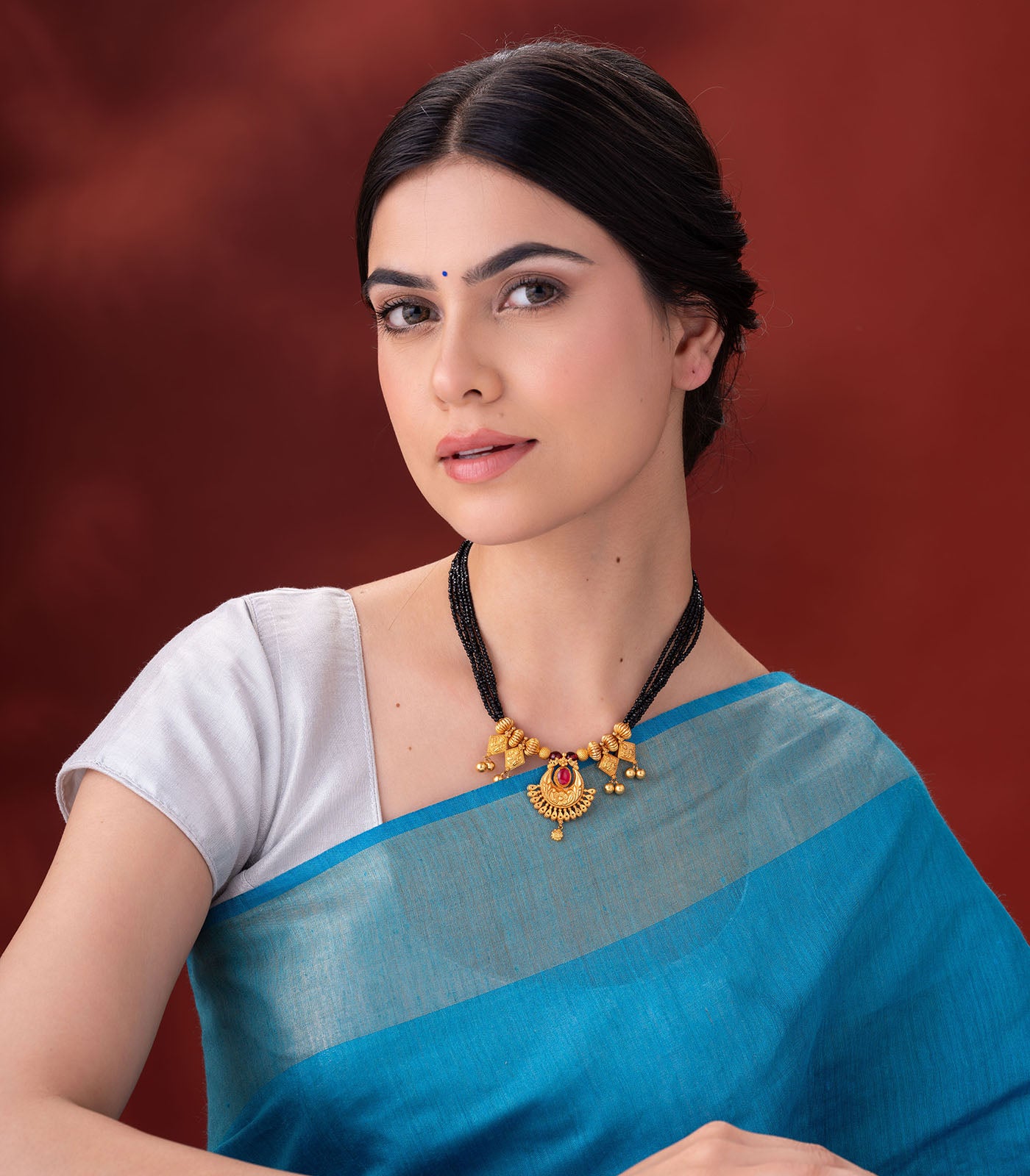 Black Beaded Gold Necklace with Red Stone and Dangle Accents