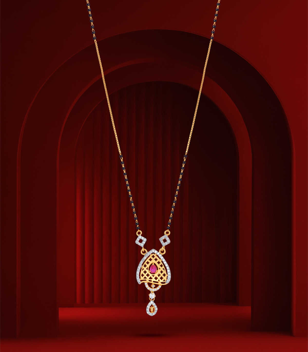 Delicate mangalsutra with a heart-shaped pendant on a red background